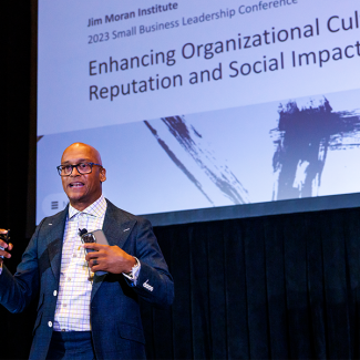 Photo of Esu Ma’at speaking at the Small Business Leadership Conference in Orlando, Florida